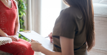Social worker conducting a social work assessment with a client